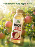 Hero shot of Yizhibi 100% Pure Apple Juice bottle set against a beautiful sunlit apple orchard with fresh red apples on branches. Text reads: From Fresh Orchard To Your Bottle.